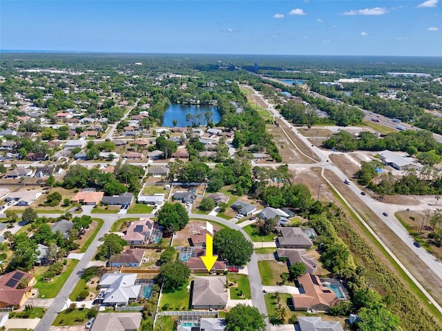 aerial view featuring a water view and a residential view