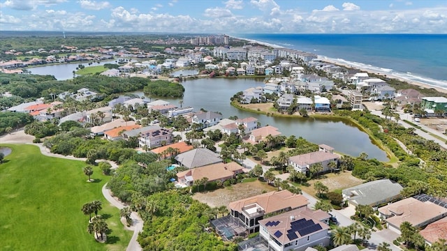 birds eye view of property with a residential view and a water view