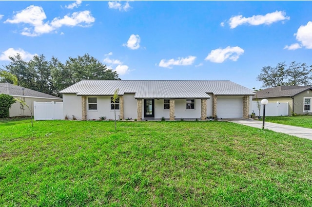 77 Freeport Ln, Palm Coast, FL 32137 - single story home with concrete driveway, an attached garage, metal roof, stone siding, and stucco siding