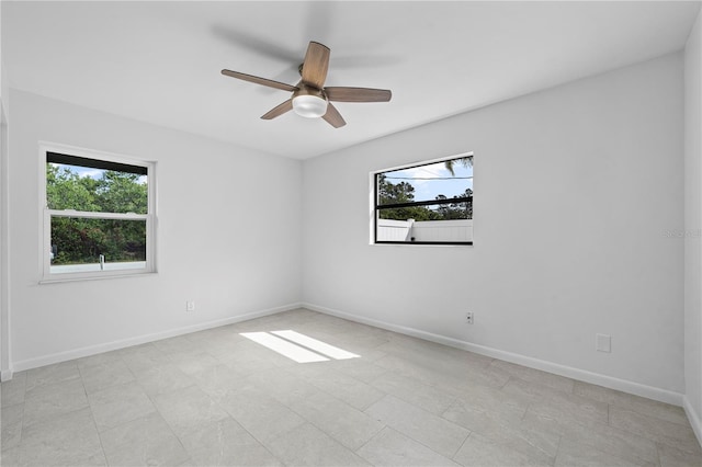 77 Freeport Ln, Palm Coast, FL 32137 - empty room with a ceiling fan and baseboards