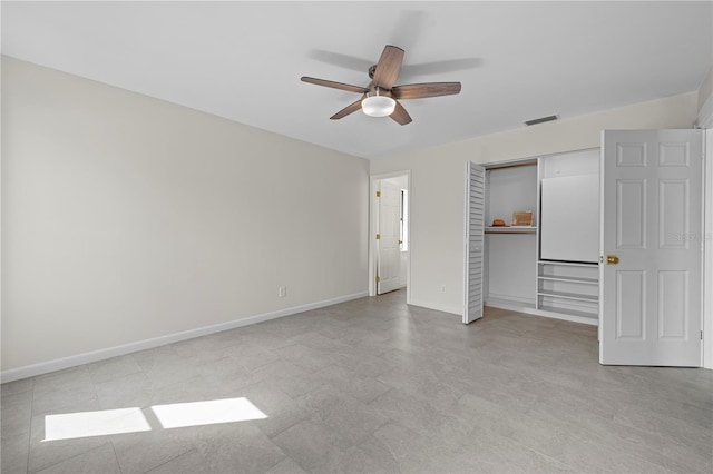 77 Freeport Ln, Palm Coast, FL 32137 - unfurnished bedroom featuring baseboards, a closet, and a ceiling fan