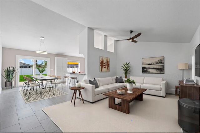 77 Freeport Ln, Palm Coast, FL 32137 - tiled living area with a ceiling fan and vaulted ceiling