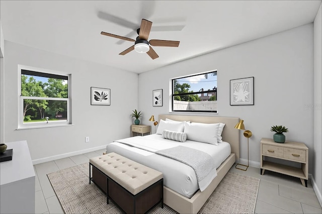 77 Freeport Ln, Palm Coast, FL 32137 - bedroom featuring light tile patterned floors, baseboards, and ceiling fan