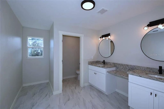 1 Fanshawe Ln, Palm Coast, FL 32137 - bathroom featuring visible vents, marble finish floor, toilet, and a sink