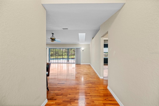 1501 Lambert Ave, Flagler Beach, FL 32136 - corridor featuring wood finished floors and a textured wall