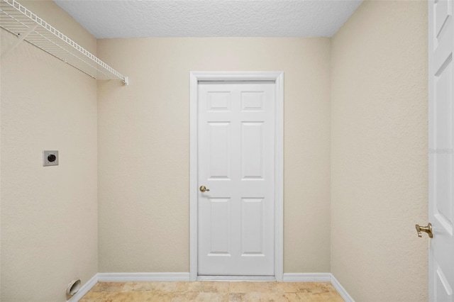 1501 Lambert Ave, Flagler Beach, FL 32136 - washroom featuring hookup for an electric dryer and a textured ceiling