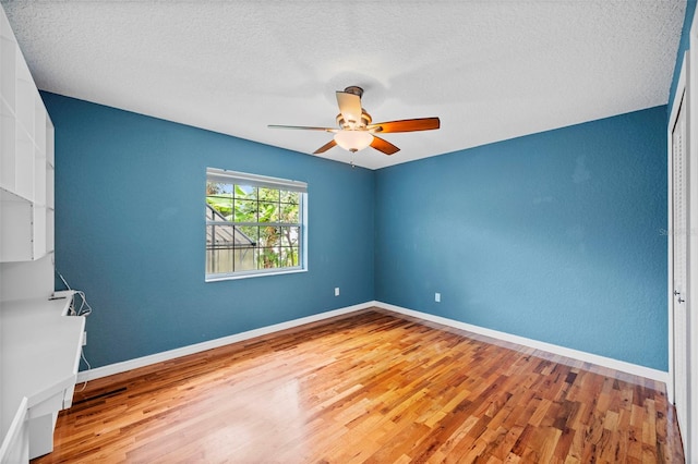 1501 Lambert Ave, Flagler Beach, FL 32136 - unfurnished room featuring wood finished floors, a ceiling fan, and a textured ceiling