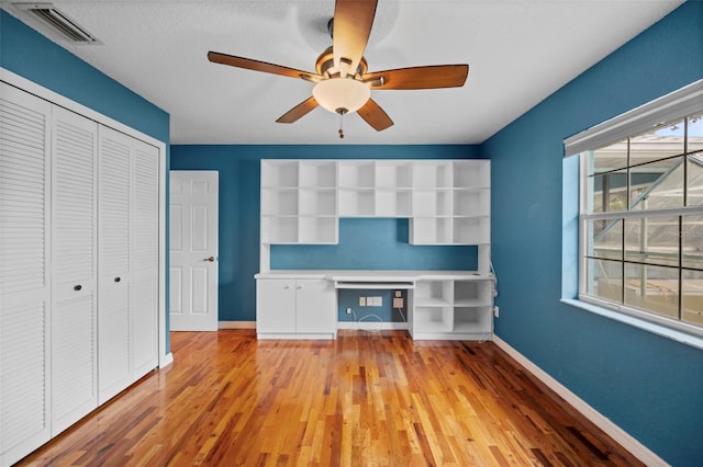 1501 Lambert Ave, Flagler Beach, FL 32136 - unfurnished living room with light wood-type flooring, an office area, and a ceiling fan