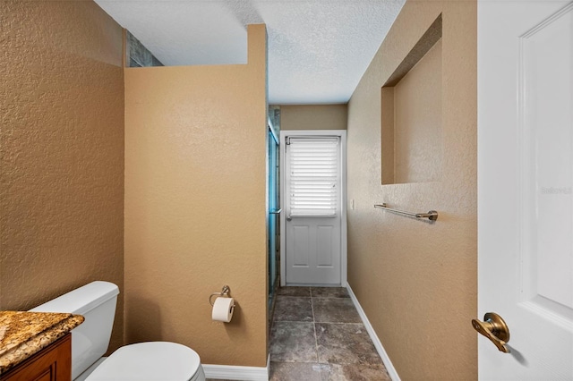 1501 Lambert Ave, Flagler Beach, FL 32136 - bathroom with vanity, a textured ceiling, and a textured wall