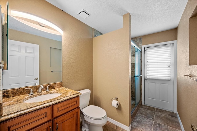 1501 Lambert Ave, Flagler Beach, FL 32136 - bathroom with a stall shower, vanity, a textured wall, and a textured ceiling