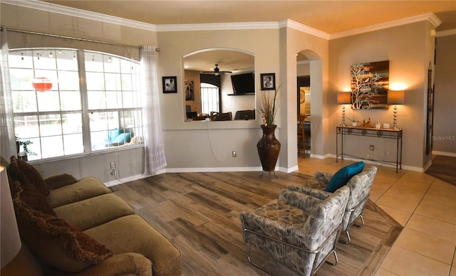 5 Baltimore Ln, Palm Coast, FL 32137 - living room with arched walkways, a wealth of natural light, and ornamental molding