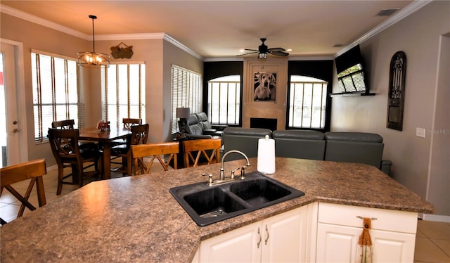 5 Baltimore Ln, Palm Coast, FL 32137 - kitchen with a sink, baseboards, a ceiling fan, open floor plan, and light tile patterned flooring