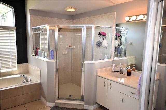 5 Baltimore Ln, Palm Coast, FL 32137 - full bathroom with tile patterned floors, vanity, a shower stall, and a bath
