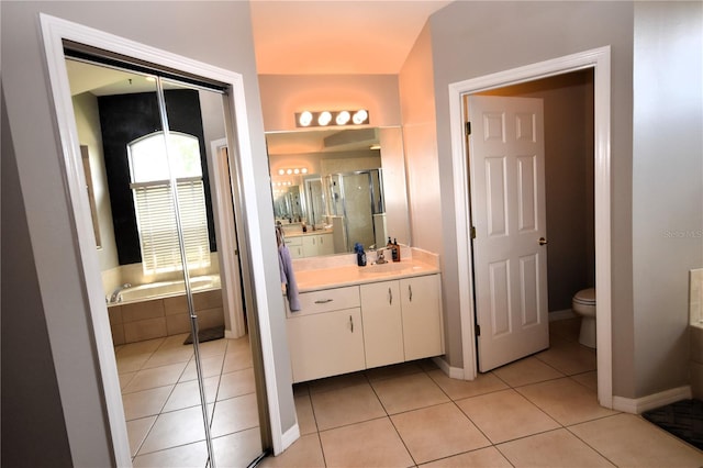 5 Baltimore Ln, Palm Coast, FL 32137 - bathroom with toilet, vanity, a shower stall, and tile patterned floors
