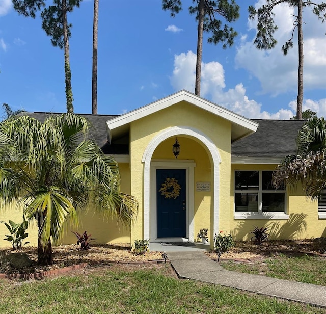 161 Bayside Dr, Palm Coast, FL 32137 - entrance to property featuring stucco siding and roof with shingles