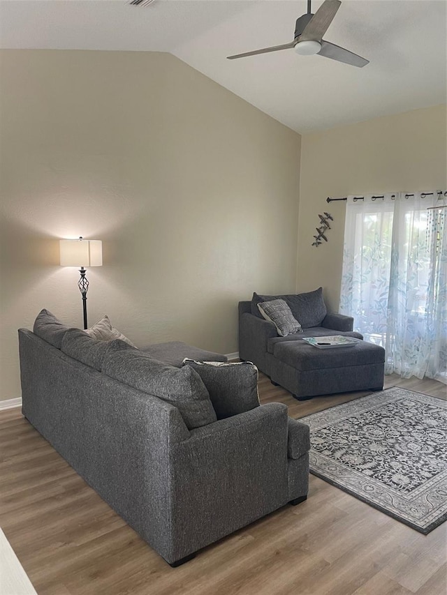 161 Bayside Dr, Palm Coast, FL 32137 - living area with wood finished floors, vaulted ceiling, and a ceiling fan