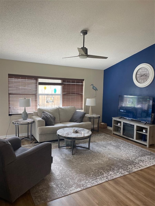 161 Bayside Dr, Palm Coast, FL 32137 - living area featuring a ceiling fan, wood finished floors, and a textured ceiling