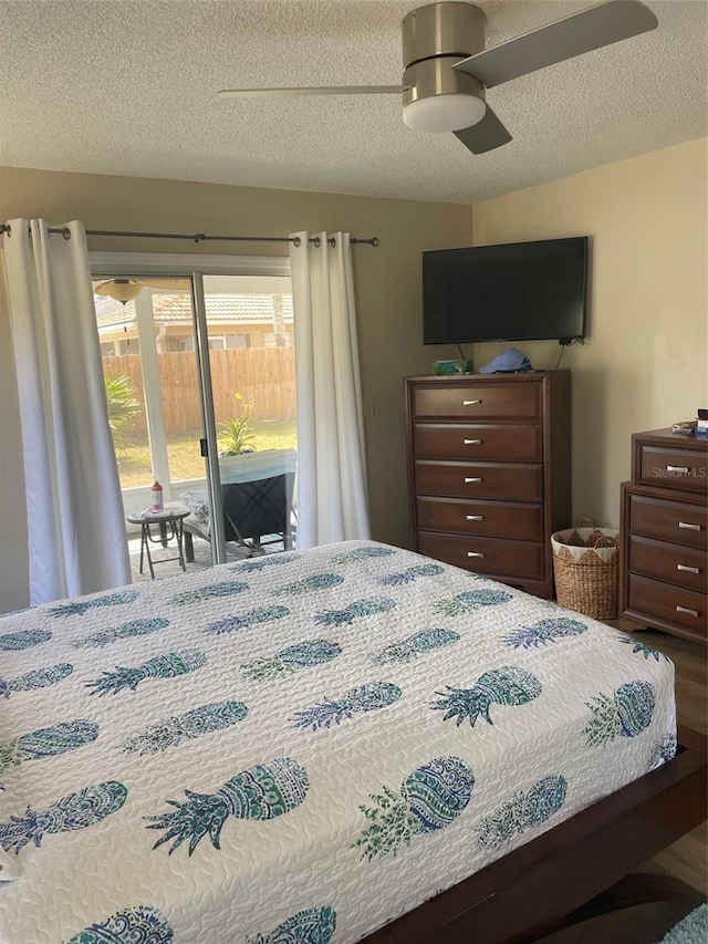 161 Bayside Dr, Palm Coast, FL 32137 - bedroom with access to exterior, a textured ceiling, ceiling fan, and wood finished floors