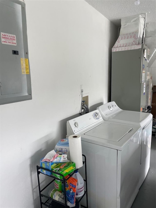 161 Bayside Dr, Palm Coast, FL 32137 - laundry room featuring separate washer and dryer, electric panel, and a textured ceiling