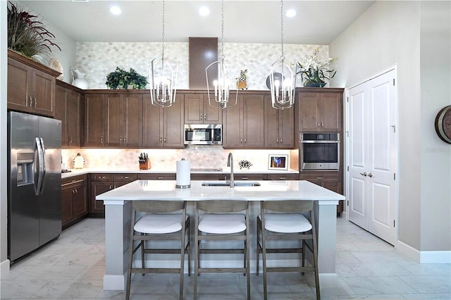 628 Mahogany Run, Palm Coast, FL 32137 - kitchen with stainless steel appliances, a notable chandelier, marble finish floor, and a sink