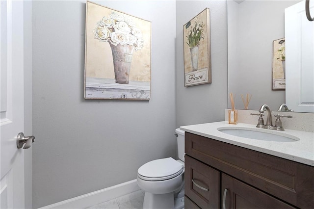 628 Mahogany Run, Palm Coast, FL 32137 - half bathroom with toilet, marble finish floor, vanity, and baseboards