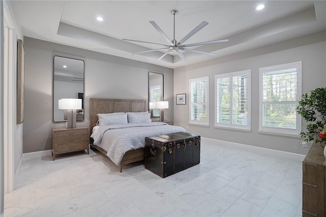 628 Mahogany Run, Palm Coast, FL 32137 - bedroom featuring recessed lighting, marble finish floor, a raised ceiling, and baseboards