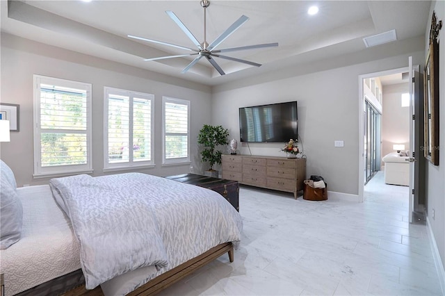 628 Mahogany Run, Palm Coast, FL 32137 - bedroom featuring recessed lighting, multiple windows, a raised ceiling, and baseboards