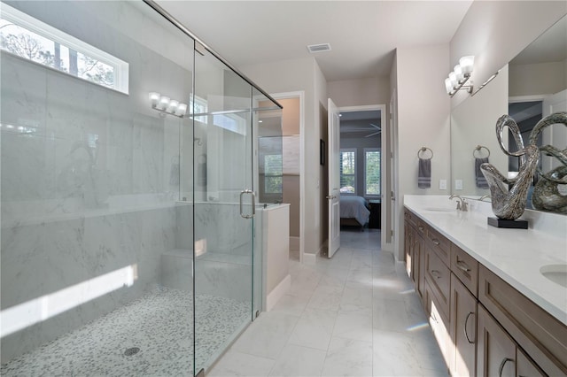 628 Mahogany Run, Palm Coast, FL 32137 - ensuite bathroom featuring a shower stall, visible vents, ensuite bathroom, baseboards, and marble finish floor