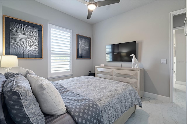 628 Mahogany Run, Palm Coast, FL 32137 - bedroom with ceiling fan, marble finish floor, and baseboards