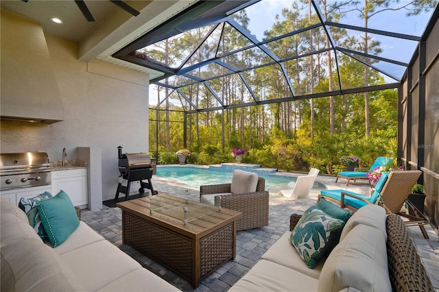 628 Mahogany Run, Palm Coast, FL 32137 - view of patio with an outdoor hangout area, exterior kitchen, an outdoor pool, grilling area, and a sink