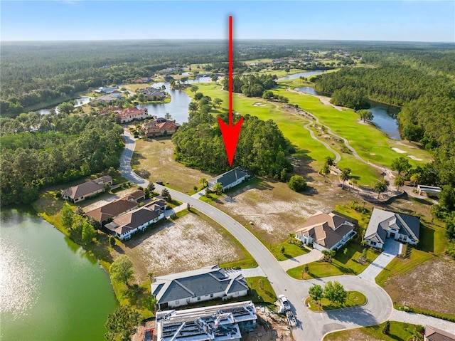 628 Mahogany Run, Palm Coast, FL 32137 - bird's eye view with golf course view, a water view, and a view of trees