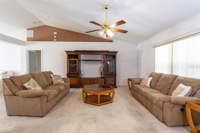 living room featuring visible vents, ceiling fan, carpet, and lofted ceiling