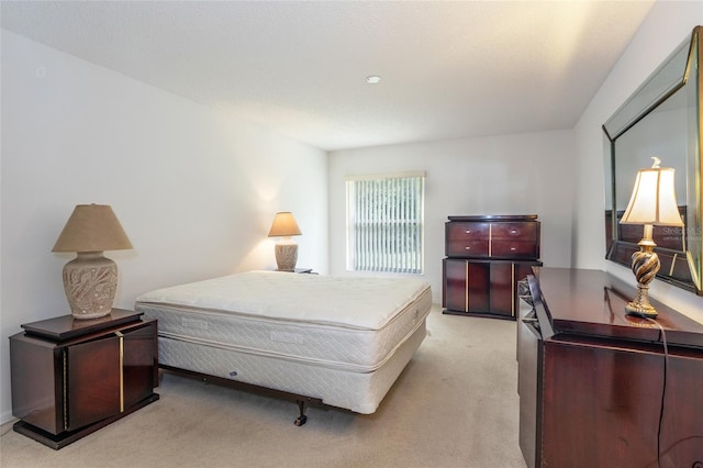 bedroom with light colored carpet