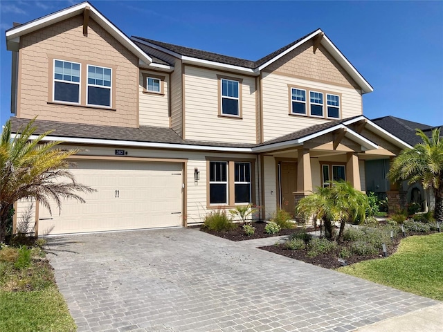 382 Aquamarine Way, Daytona Beach, FL 32124 - view of front of home with a garage, a shingled roof, and driveway