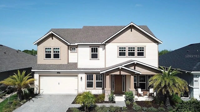 382 Aquamarine Way, Daytona Beach, FL 32124 - craftsman inspired home featuring driveway, a shingled roof, and an attached garage