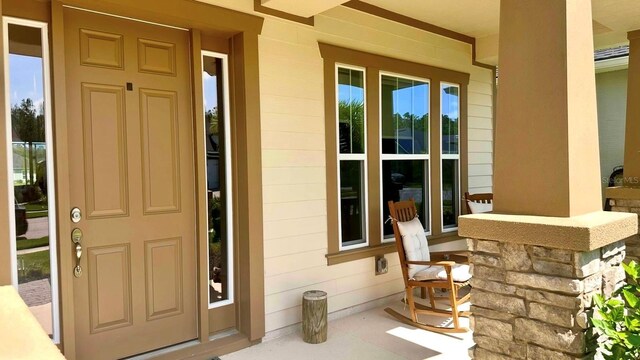 382 Aquamarine Way, Daytona Beach, FL 32124 - doorway to property featuring a porch