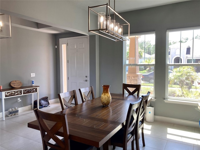 382 Aquamarine Way, Daytona Beach, FL 32124 - dining area featuring light tile patterned floors, a notable chandelier, and baseboards