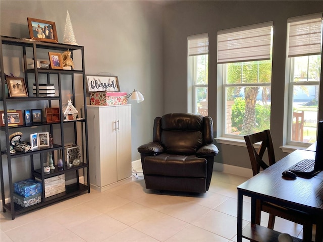 382 Aquamarine Way, Daytona Beach, FL 32124 - living area with tile patterned floors, baseboards, and a healthy amount of sunlight
