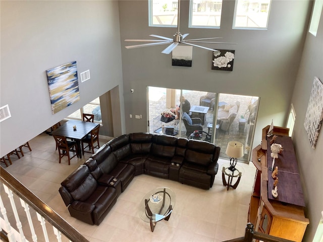 382 Aquamarine Way, Daytona Beach, FL 32124 - tiled living area with ceiling fan, plenty of natural light, visible vents, and a high ceiling