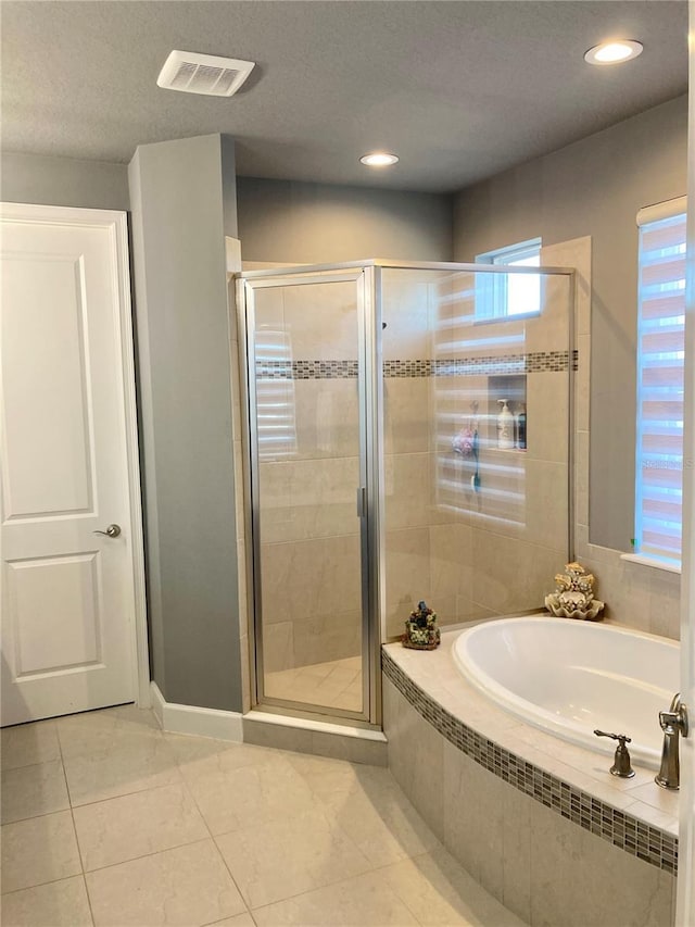 382 Aquamarine Way, Daytona Beach, FL 32124 - full bathroom featuring a garden tub, recessed lighting, visible vents, and a shower stall