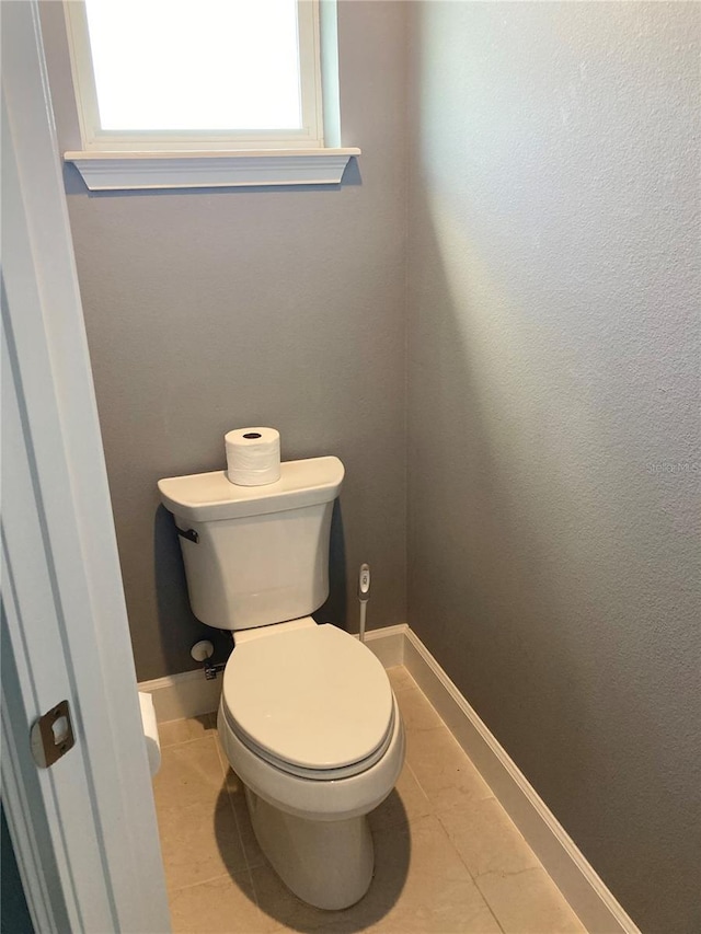 382 Aquamarine Way, Daytona Beach, FL 32124 - bathroom featuring toilet, tile patterned floors, and baseboards