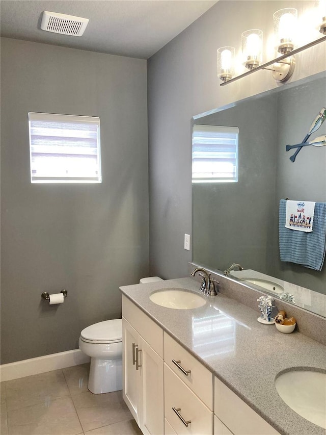 382 Aquamarine Way, Daytona Beach, FL 32124 - bathroom with tile patterned floors, visible vents, a wealth of natural light, and a sink