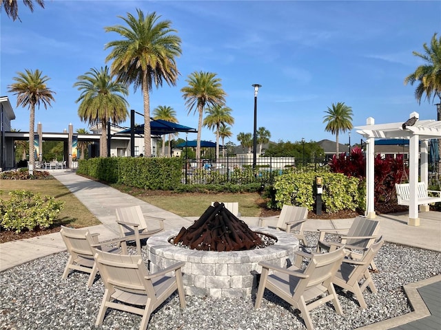 382 Aquamarine Way, Daytona Beach, FL 32124 - view of patio with a pergola, fence, and an outdoor fire pit