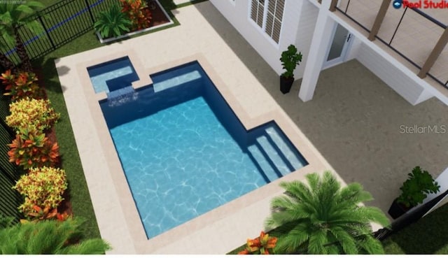 view of pool featuring fence