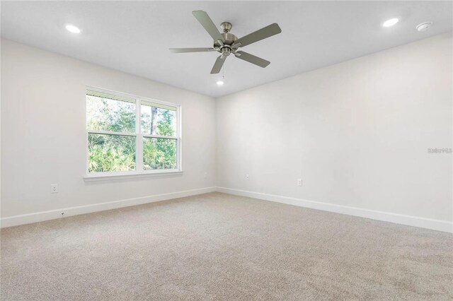 21 Uniondale Pl, Palm Coast, FL 32164 - spare room featuring light colored carpet, recessed lighting, and baseboards