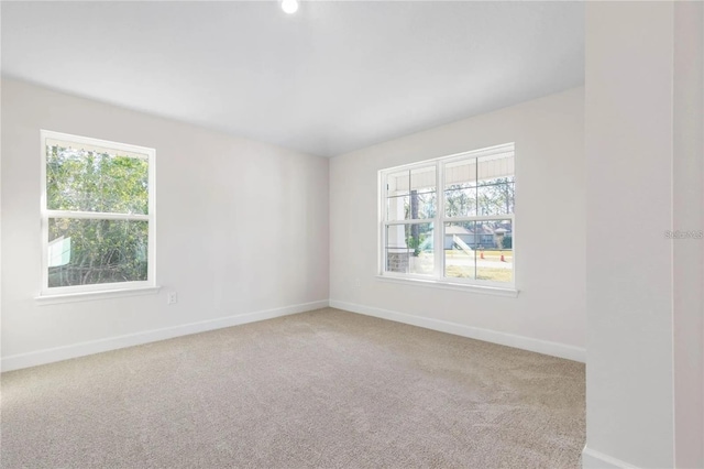 21 Uniondale Pl, Palm Coast, FL 32164 - carpeted empty room with baseboards