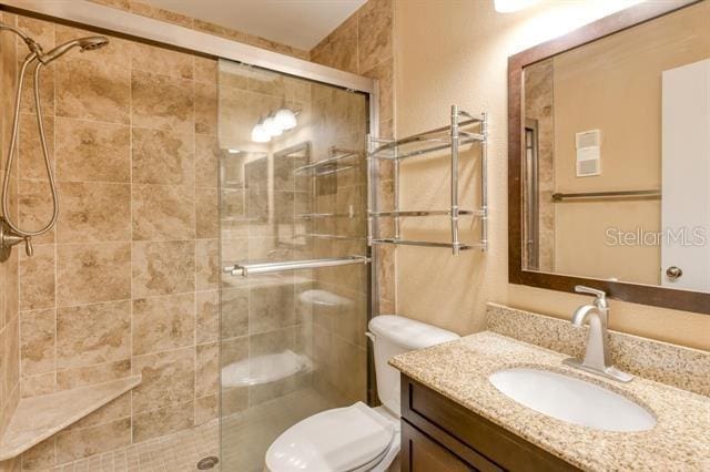 27 Catalonia Ct Unit A, Saint Augustine, FL 32086 - full bath featuring vanity, a stall shower, and toilet