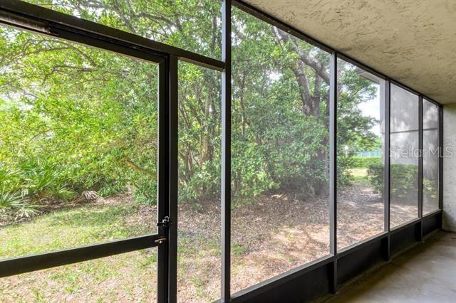 27 Catalonia Ct Unit A, Saint Augustine, FL 32086 - view of unfurnished sunroom
