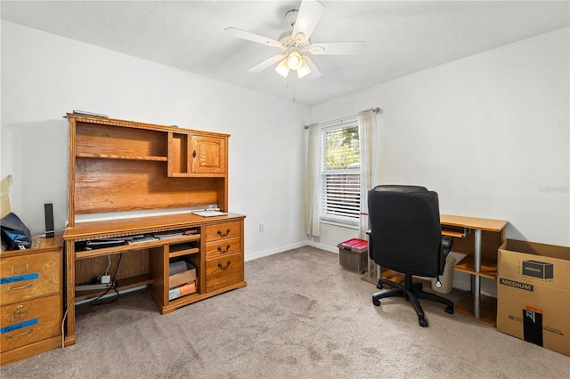 office area featuring light colored carpet and a ceiling fan
