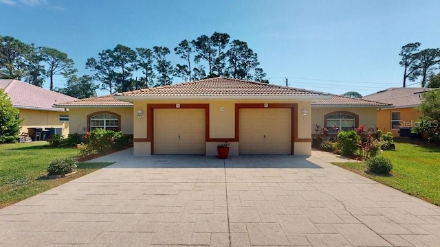 view of front of house featuring an attached garage, stucco siding, and a tile roof